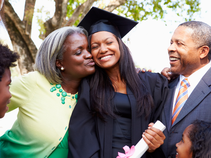 graduate enjoying smiling time with family