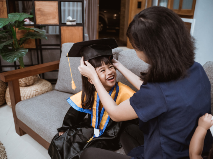 mom placing cap on graduate Beaverton OR